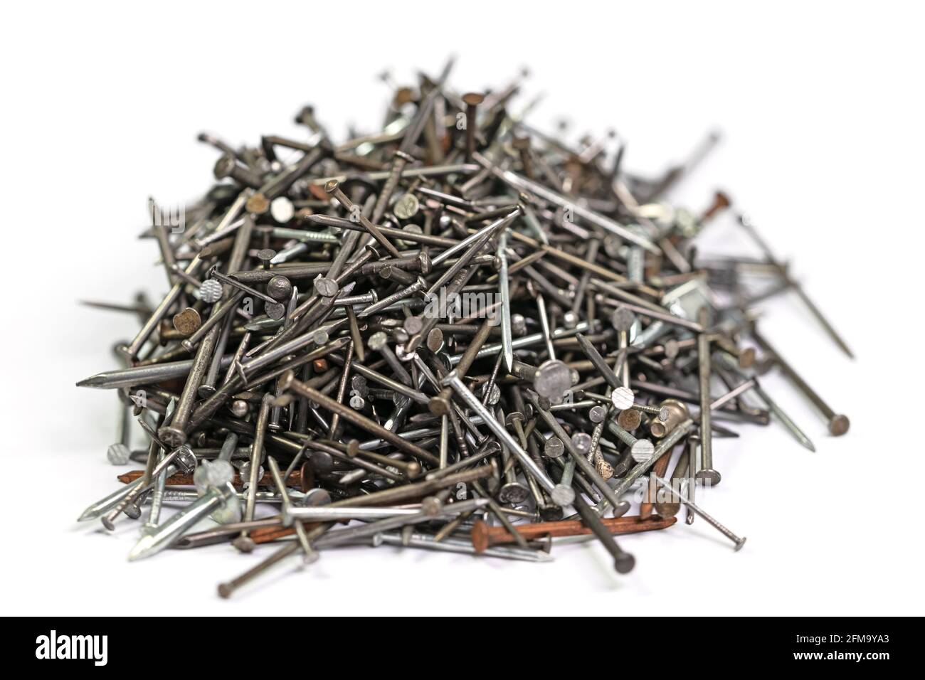 Many different nails against a white background Stock Photo