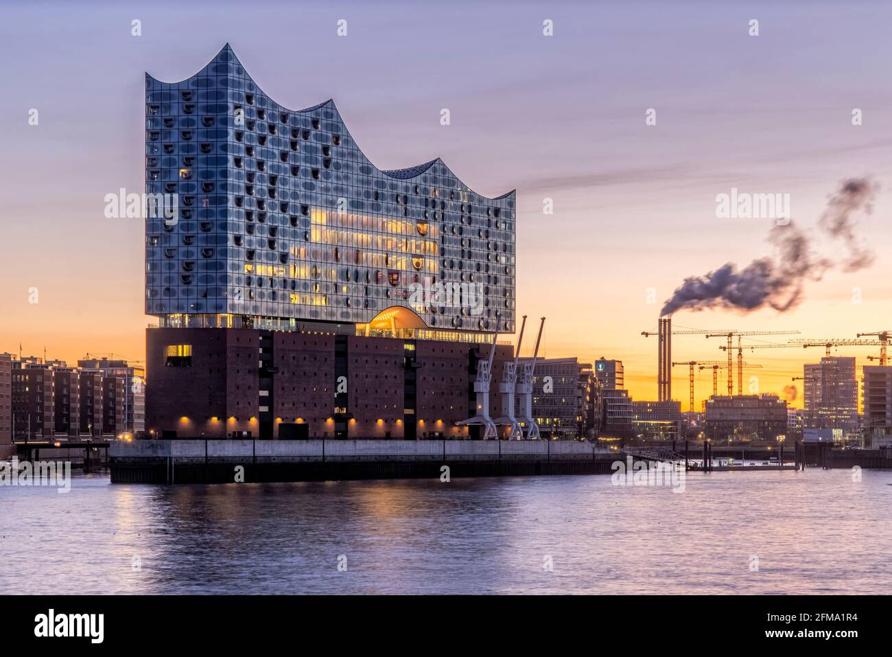 View over the Elbe in the blue hour to the Elbphilharmonie in the early morning Stock Photo