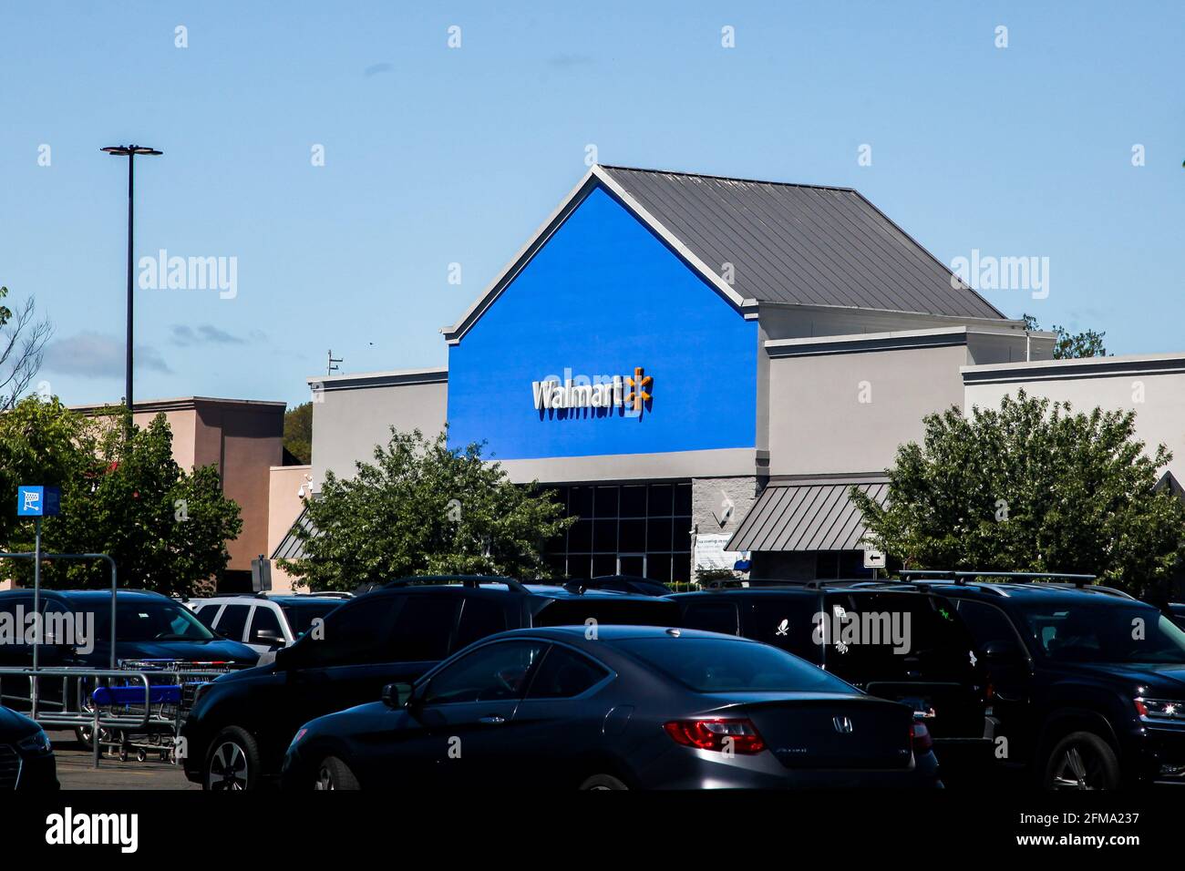 NORWALK, CONNECTICUT MAY 6, 2021 Walmart store sign with blue sky
