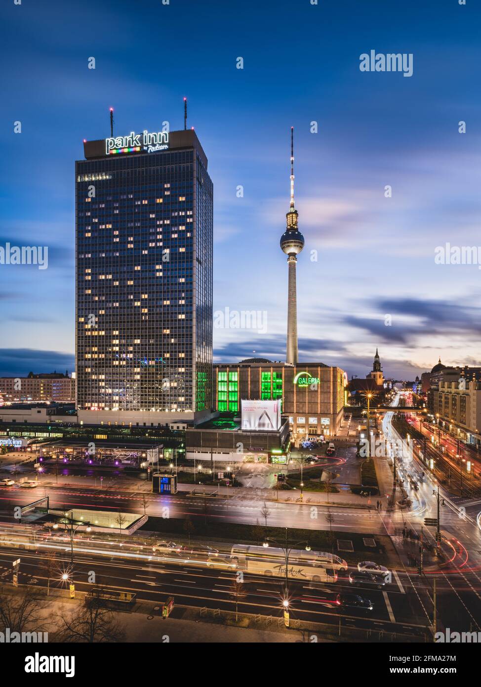 View of the illuminated streets of Berlin with the TV tower and Alexanderplatz at night. Stock Photo
