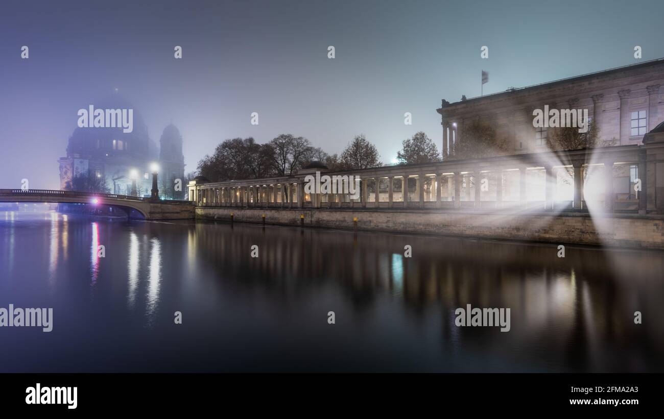 Illuminated Berlin Cathedral and Old National Gallery on Museum Island on the Spree at night. Stock Photo