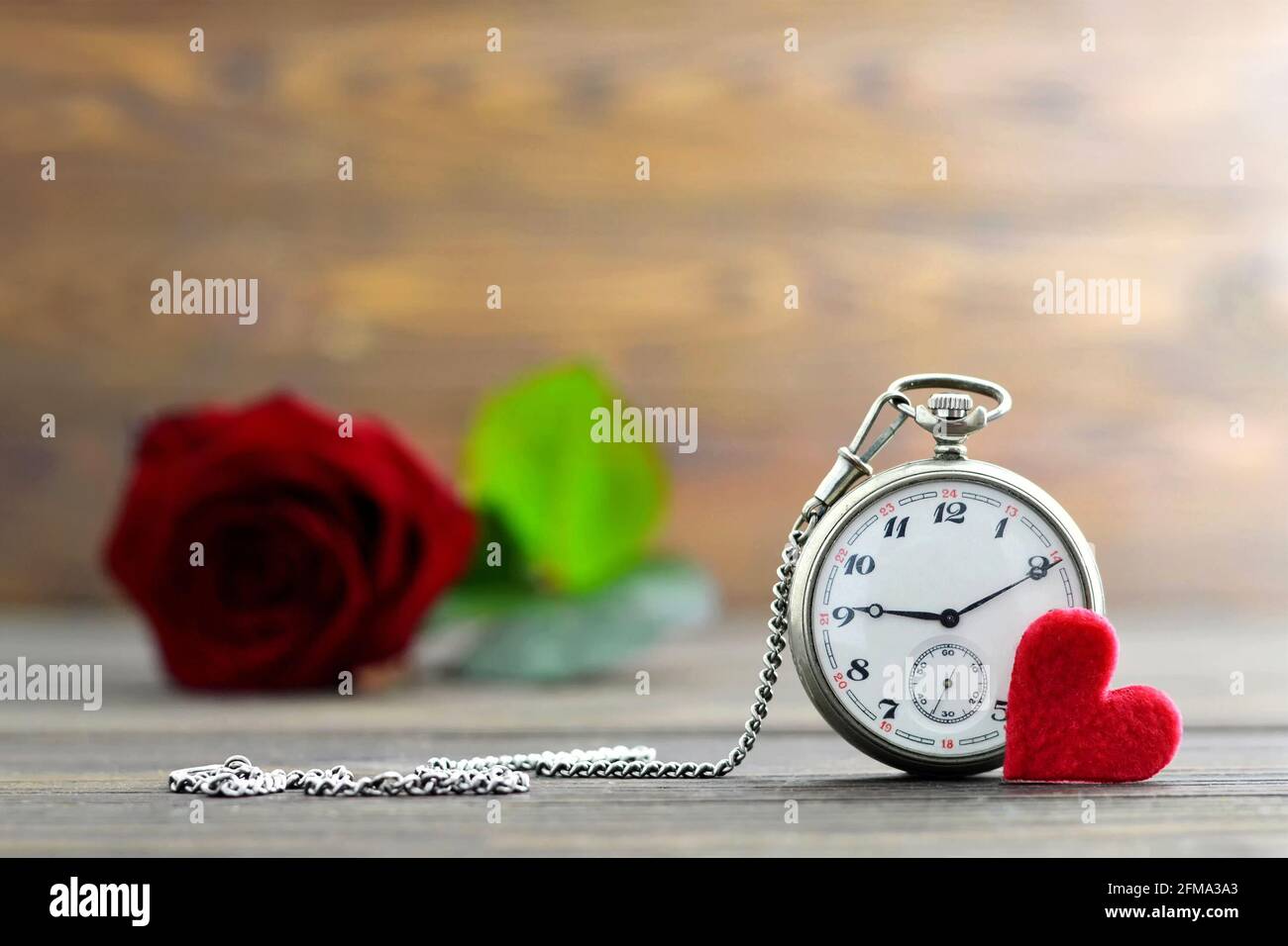 Fathers Day gift. Vintage ocket watch, heart and red rose Stock Photo