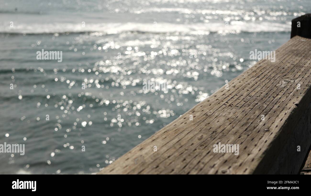 Railings of old wooden pier, waterfront boardwalk, Oceanside beach ...