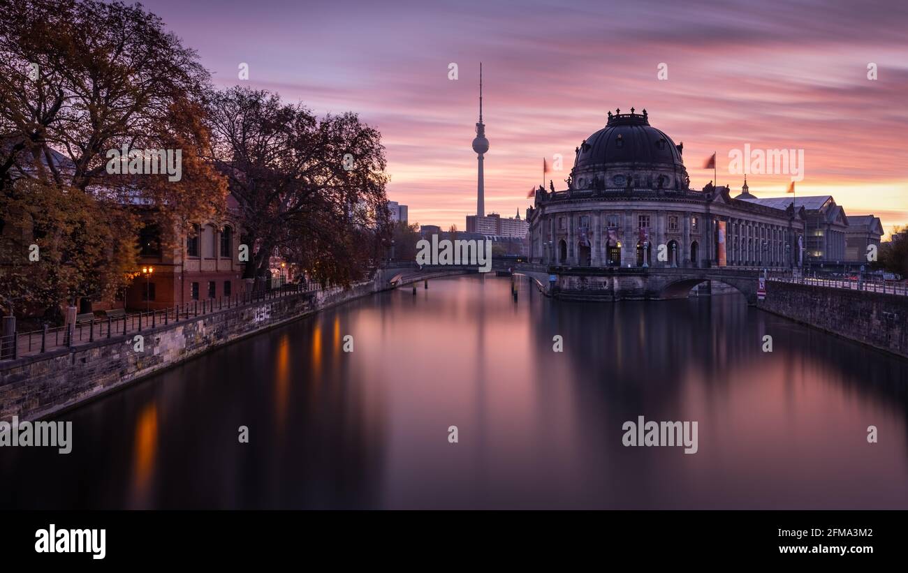 Sunrise on Museum Island with a view of the Bode Museum and the TV tower in Berlin. Stock Photo