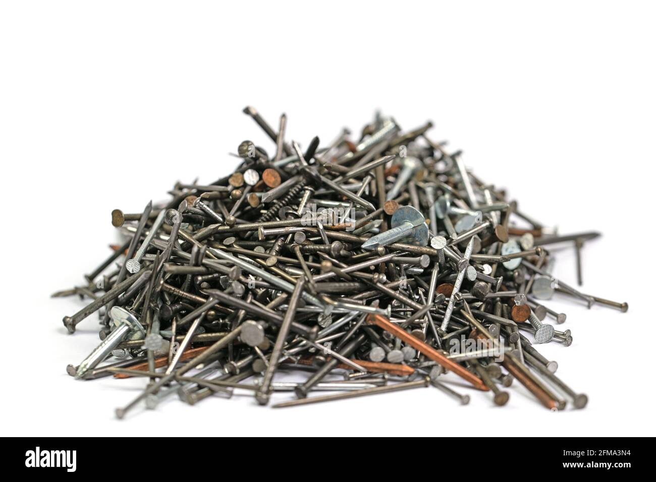 Many different nails against a white background Stock Photo