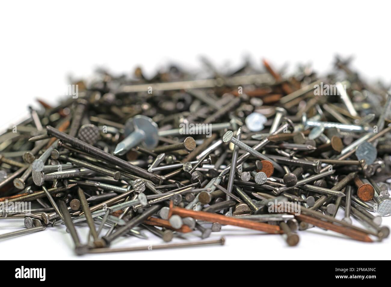 Many different nails against a white background Stock Photo