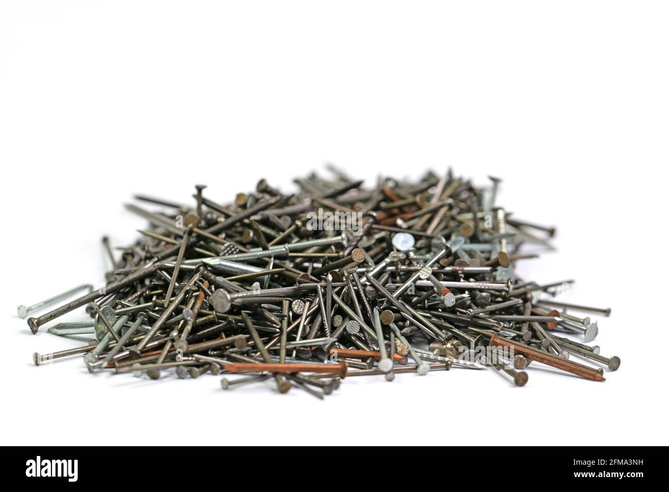 Many different nails against a white background Stock Photo