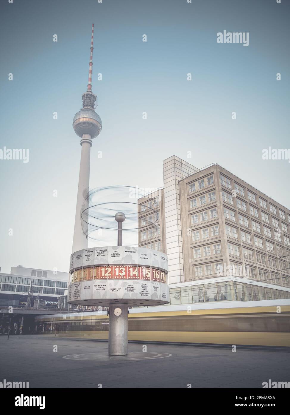 Moving tram at the world clock on Alexanderplatz at the television tower in Berlin. Stock Photo