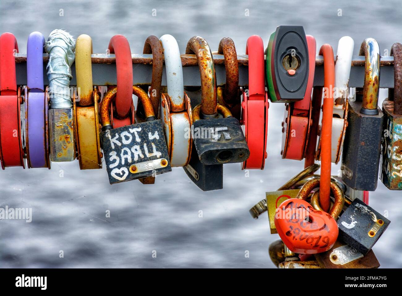 Locks hung on the railing of the bridge according to tradition on the ...