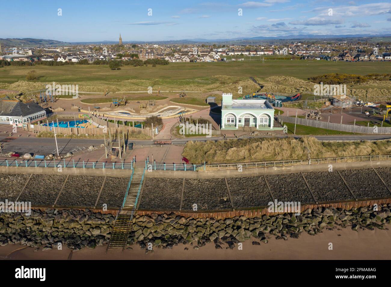 Aerial view of the rock armour protecting Montrose sea front Splash play area and art deco Trail Pavilion, Montrose, Angus, Scotland. Stock Photo