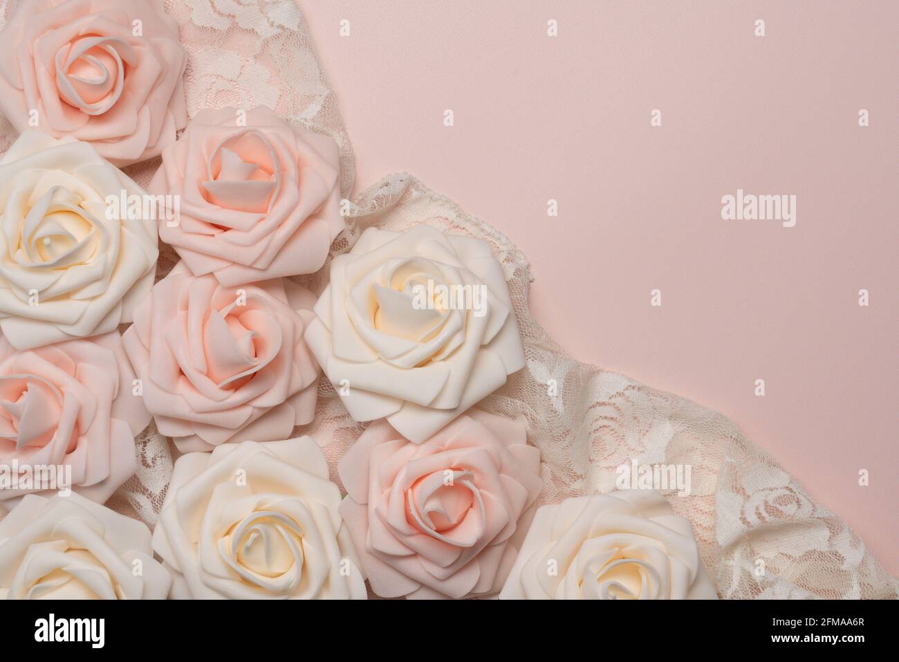 soft background of pale pink and white artificial roses and lace Stock ...
