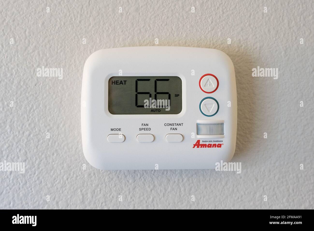 Roanoke, VA - April 25, 2021: Energy saving Amana wall themostat for under the window HVAC system in a hotel. Stock Photo