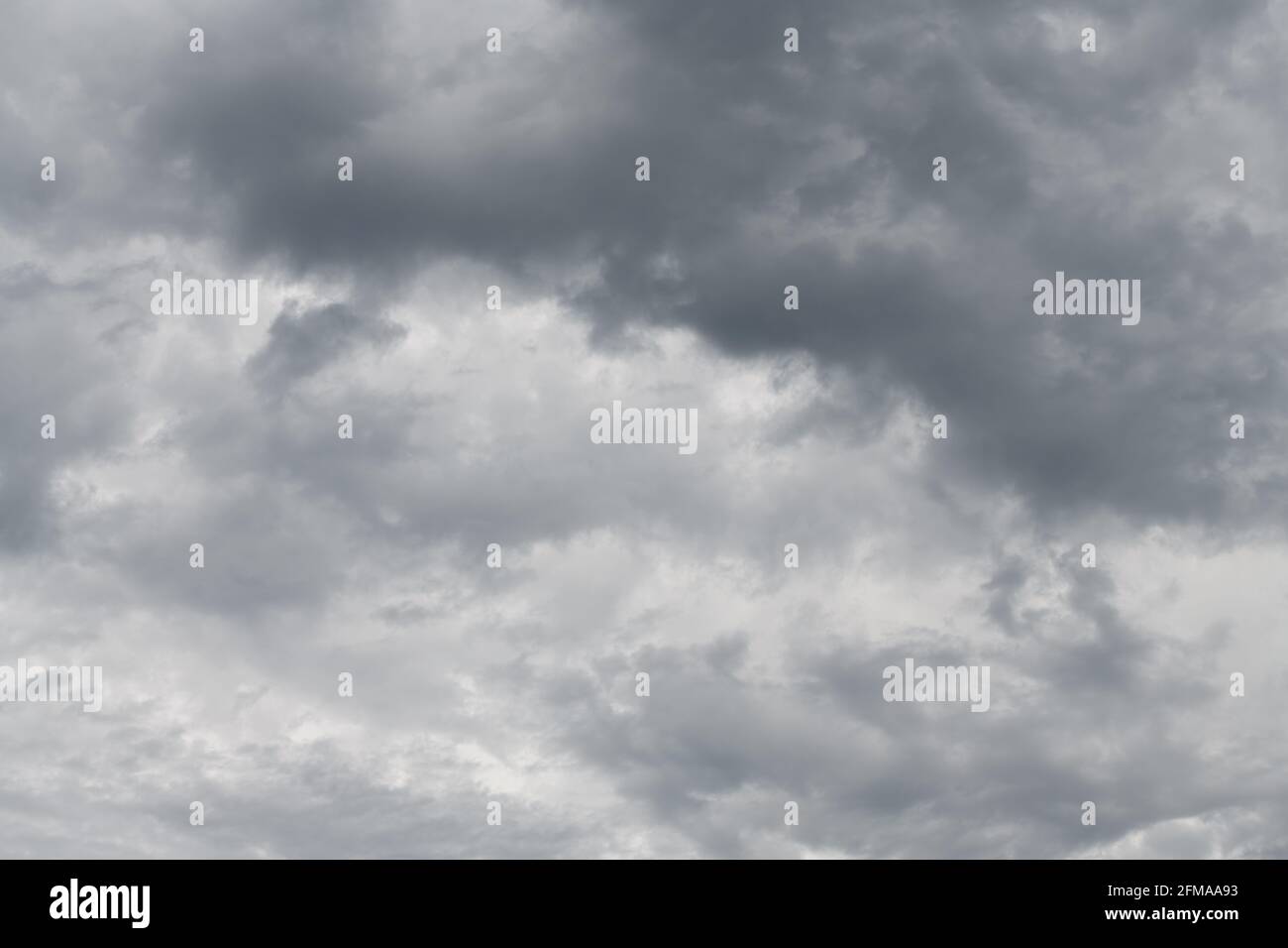 A sweeping pattern of clouds evolving as an intricate background pattern Stock Photo