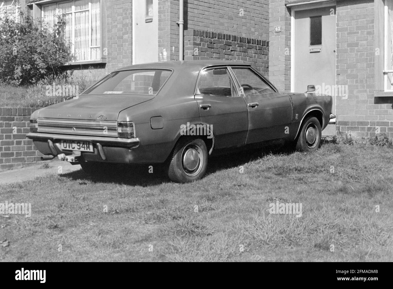 old dilapidated ford cortina mk3 parked on front lawn of house 1980s england uk Stock Photo