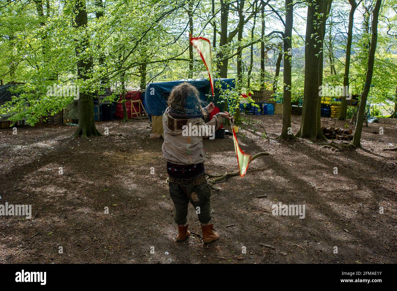 Aylesbury Vale, Buckinghamshire, UK. 7th May, 2021. A protester at the camp. The protest camp at Jones Hill Wood where HS2 are slowly destroying most of the wood. Jones Hill Wood is said to have inspired local author Roald Dahl to write the popular children's novel, The Fantastic Mr Fox. The High Speed Rail 2 from London to Birmingham is carving a huge scar across the Chilterns. Credit: Maureen McLean/Alamy Live News Stock Photo