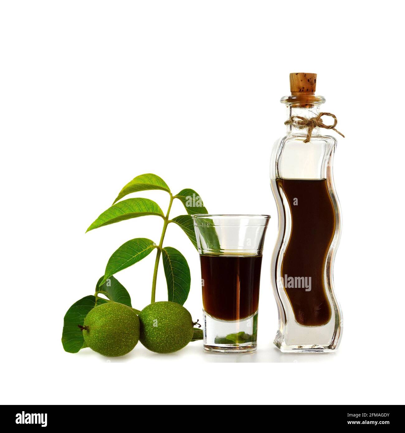 Nocino liqueur. Green walnut liqueur isolated on white background Stock Photo