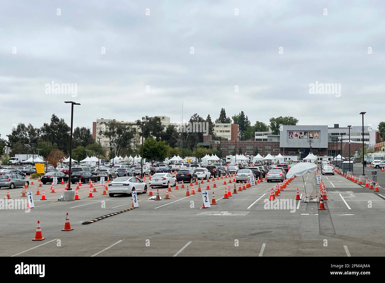 A general view of mass COVID-19 drive-up vaccination site at Cal State LA, Friday, May 7, 2021, in Los Angeles. Stock Photo
