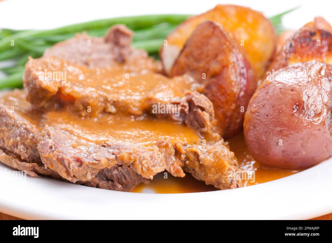 cross rib roast dinner with roasted vegetables Stock Photo Alamy