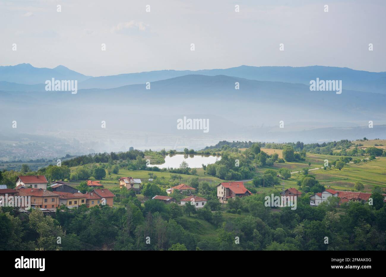 View of Gorno Draglishte and surrounding countryside from the hills above town. Razlog Municipality, Blagoevgrad province, Bulgaria Stock Photo