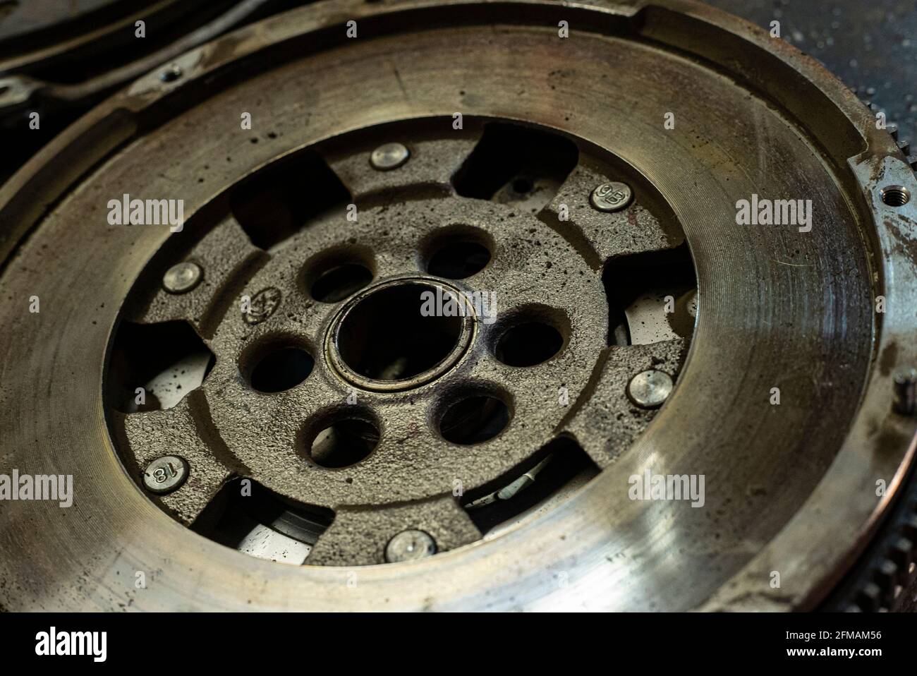 Detail of Old Car flywheel in a car spare parts Stock Photo
