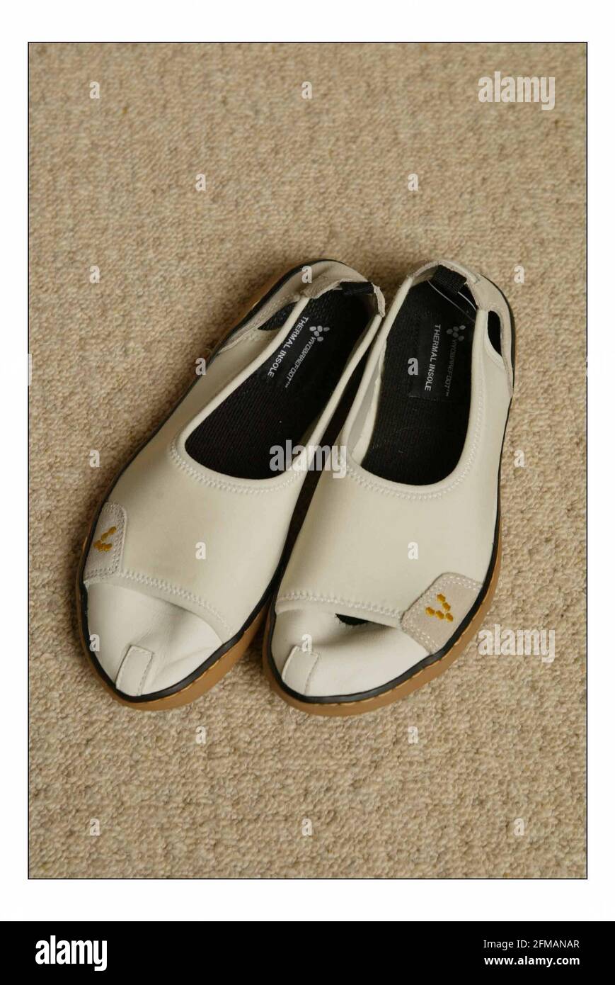 Ethical Shoes  Tested by Kate FinneganSandal, off-white, Vivo Barefoot (beige plimsoll type shoe) pic David Sandison 13/4/2005 Stock Photo