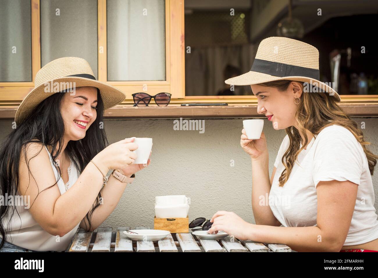 Happy couple of women young friends enjoy and have fun outdoor together -  lesbian diversity lifestyle love and friendship for happiness - beautiful  curvy caucasian female on vacation Stock Photo - Alamy