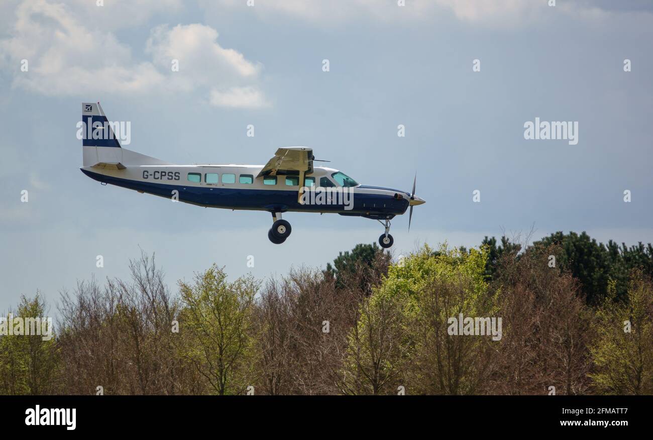 cessna 208b grand caravan light aircraft returning to land after depositing parachute jumpers Stock Photo