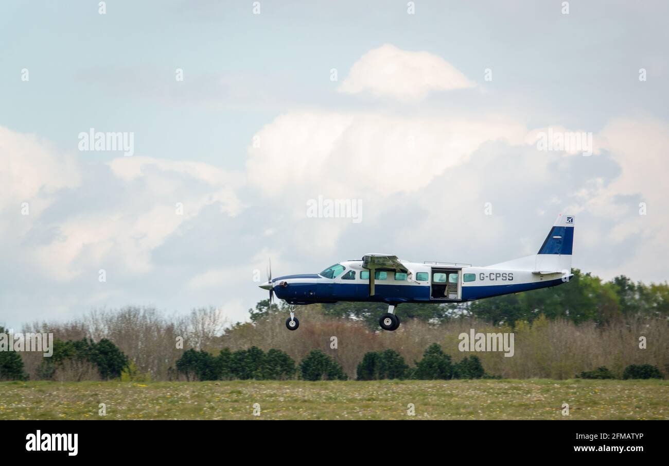 cessna 208b grand caravan light aircraft returning to land after dropping parachute jumpers Stock Photo
