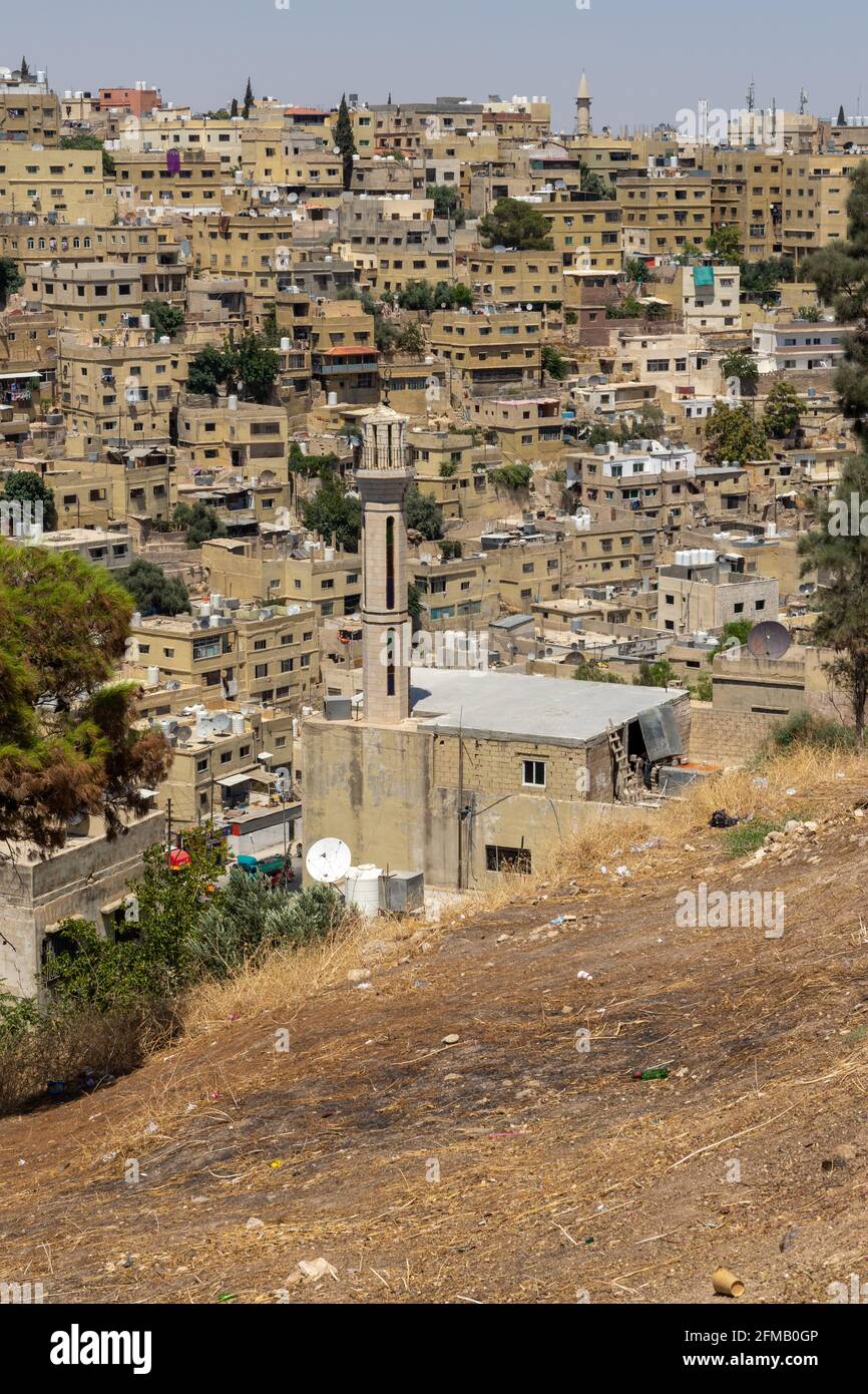 Old town of Amman, Jordan with low-rise blocks of residential buildings and old mosque Stock Photo