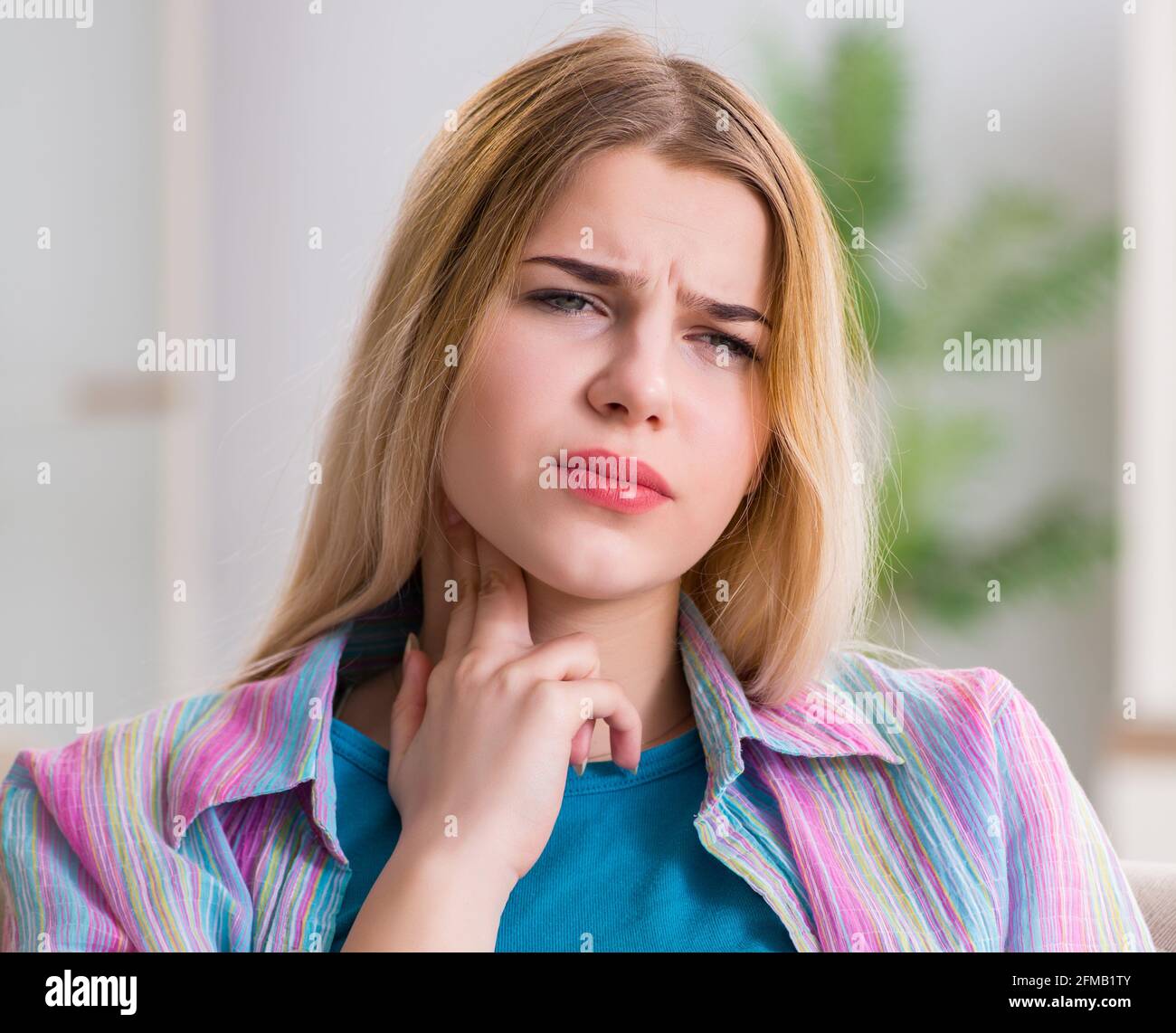 the-young-woman-suffering-from-sore-throat-pain-stock-photo-alamy