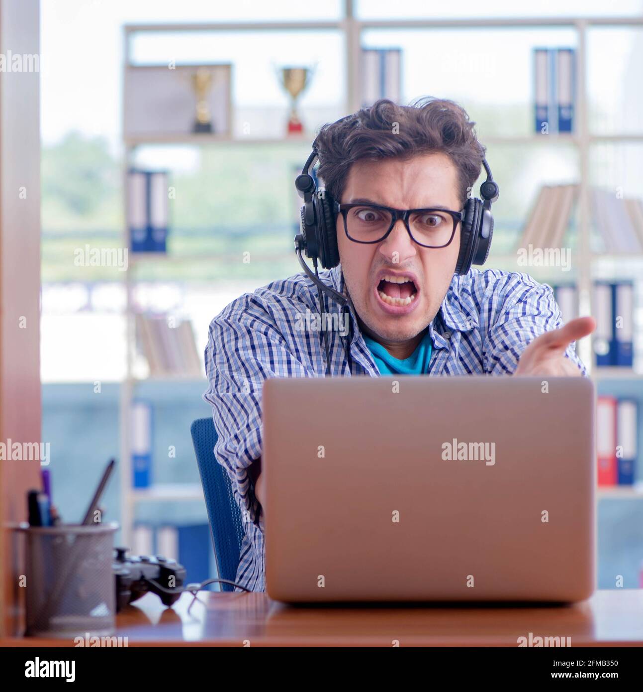 The gamer addict playing computer games at home Stock Photo - Alamy