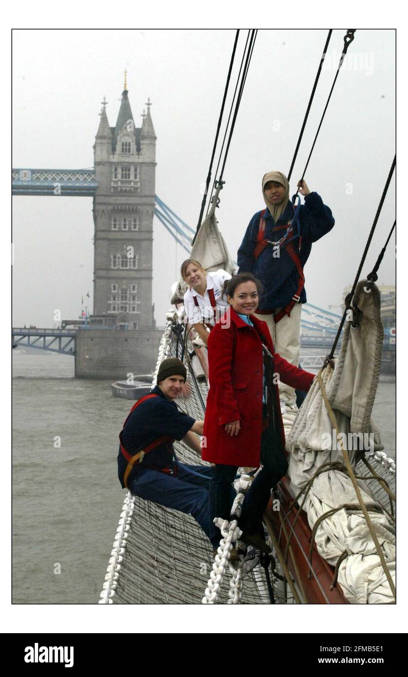 On the 12th October 2004 it will be two years since Brighton-born Daniel Braden, was killed  in the Sari nightclub in Bali by a terrorist bomb. To mark this 2nd anniversary, young people from different races cultures and religions sailed up the Thames in a tall ship, to finish a 11 night Voyage of Understanding at Tower bridge ENCOMPASS - The Daniel Braden Reconcilliation trust, the youth charity formed in his memory by his family and girlfriend Jun Hirst, organised the tallship to finish on this dayDaniel Bradens girlfriend Jun Hirst (in red jacket with Phil Lewis, Pipit Andriani and Hazel Ru Stock Photo