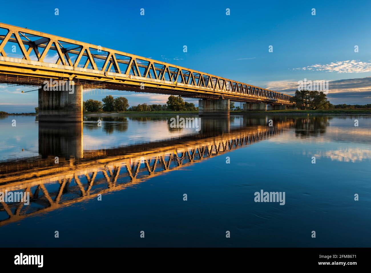 Railway bridge over the Elbe in the evening light, near Wittenberge, Brandenburg, Germany Stock Photo