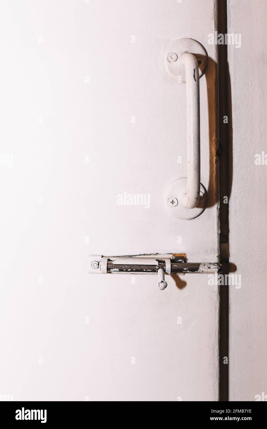 White door with latch from pantry Stock Photo