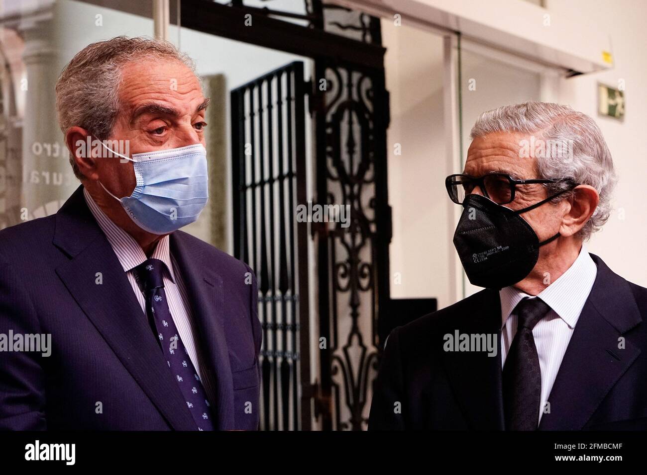 Malaga, Spain. 07th May, 2021. Former Mayor of Malaga, Luis Merino Bayona (l) and President of Fundacion Unicaja, Braulio Medel having a conversation during the exhibition at Centro Cultural Fundacion Unicaja. 'Un siglo de esplendor' is an exhibition that shows the artistic heritage of the Holy Week brotherhoods of Malaga and is one of the events organized by Agrupacion de Cofradias de Semana Santa de Malaga for the centenary of the institution. (Photo by Francis Gonzalez/SOPA Images/Sipa USA) Credit: Sipa USA/Alamy Live News Stock Photo