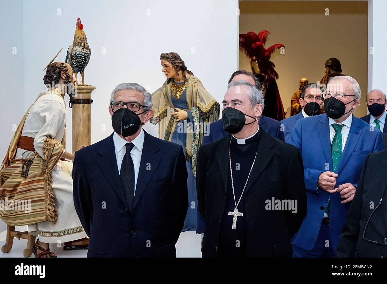 Malaga, Spain. 07th May, 2021. President of Fundacion Unicaja, Braulio Medel; Malaga Bishop, Jesus Catala Ibañez; and President of Unicaja, Manuel Azuaga seen during the exhibition at Centro Cultural Fundacion Unicaja.'Un siglo de esplendor' is an exhibition that shows the artistic heritage of the Holy Week brotherhoods of Malaga and is one of the events organized by Agrupacion de Cofradias de Semana Santa de Malaga for the centenary of the institution. (Photo by Francis Gonzalez/SOPA Images/Sipa USA) Credit: Sipa USA/Alamy Live News Stock Photo