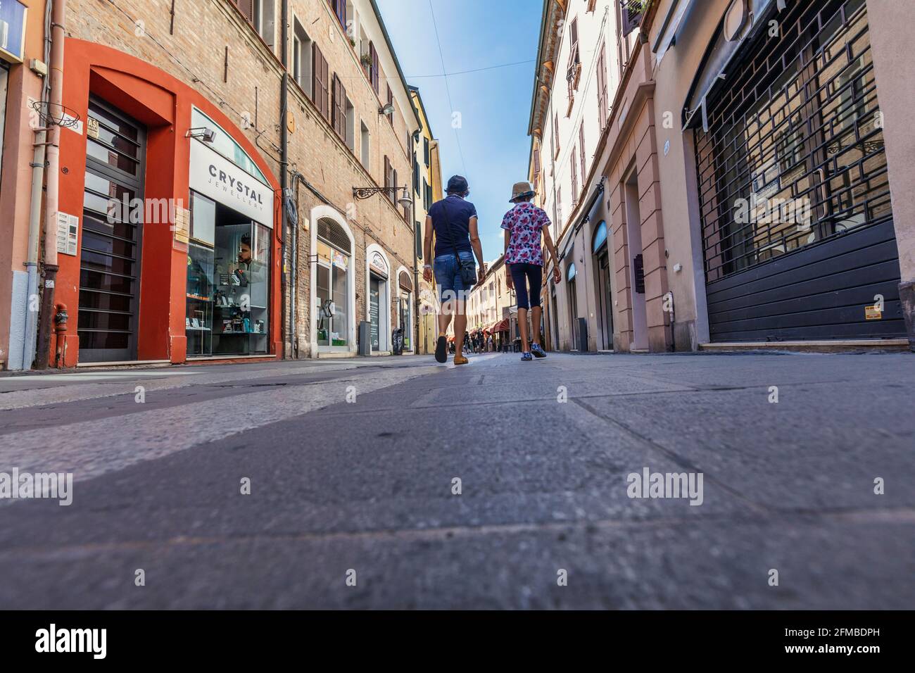 tourists stroll through the streets of the historic center of ferrara, emilia romagna, italy, europe Stock Photo