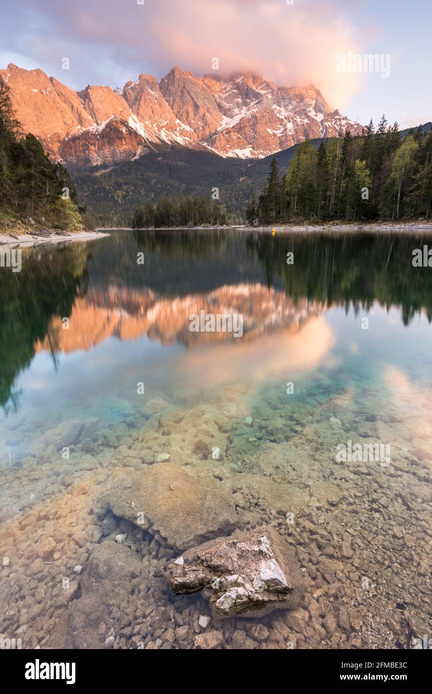 Zugspitze is reflected in lake eibsee hi-res stock photography and ...