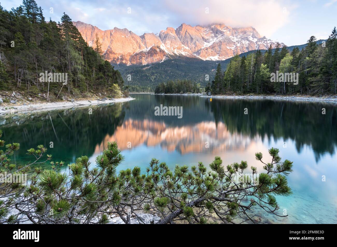 Zugspitze is reflected in lake eibsee hi-res stock photography and ...