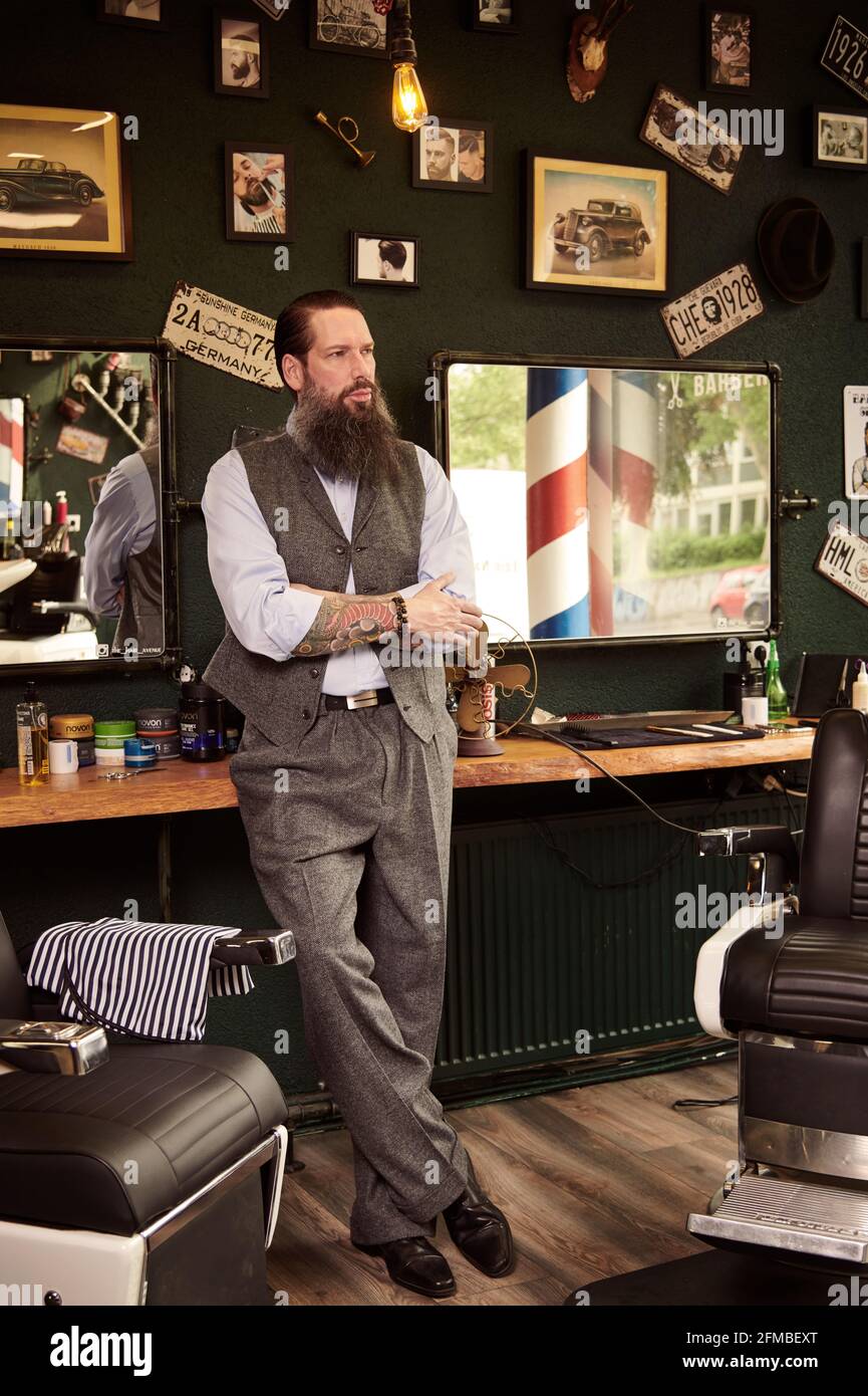 Bearded middle aged man in barber shop Stock Photo