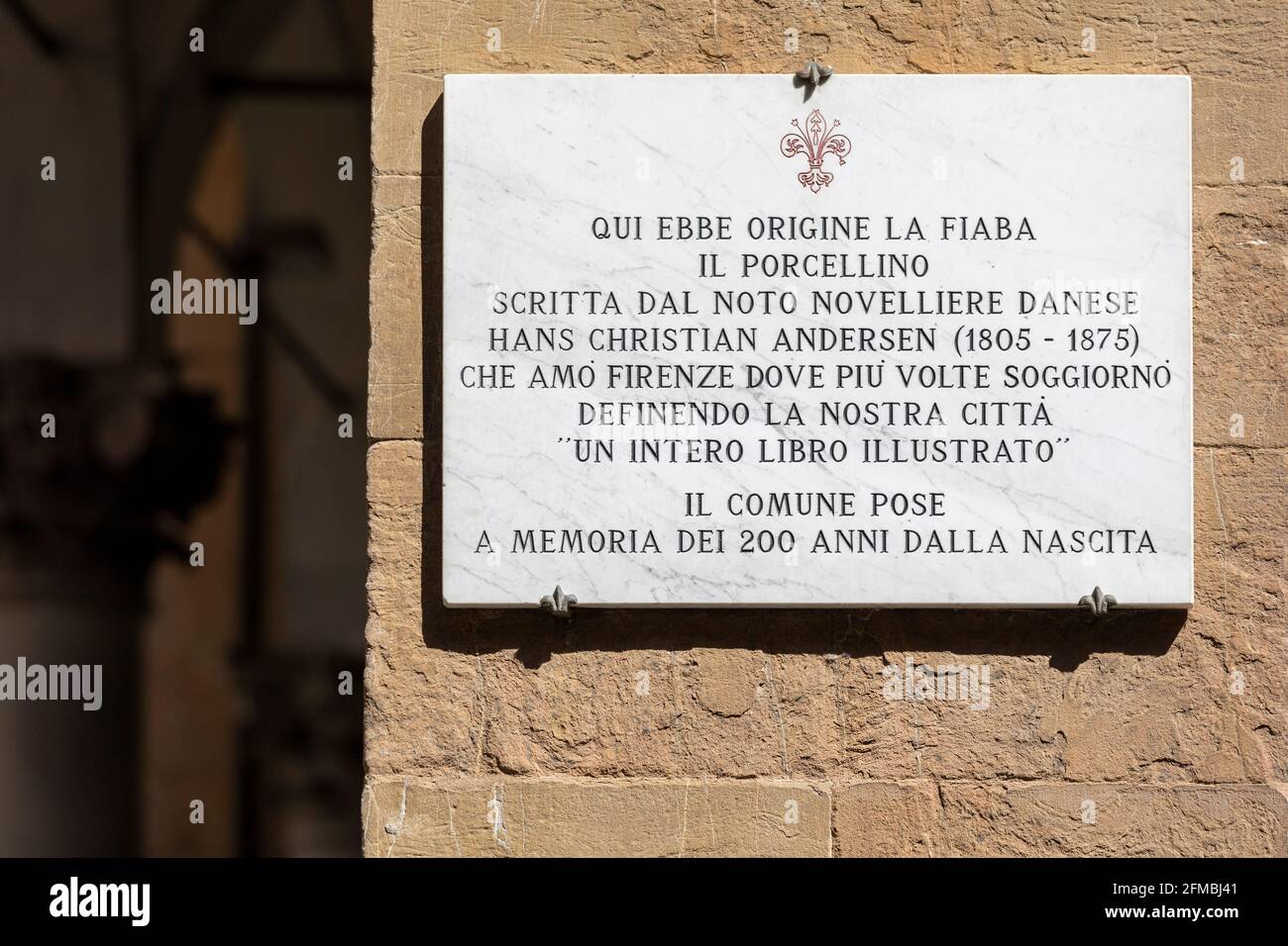 plaque commemorating the origin of the fairy tale 'Il Porcellino' by the Danish author Hans Christian Andersen, Loggia del Mercato Nuovo, leather street market in Florence, Tuscany, Italy Stock Photo