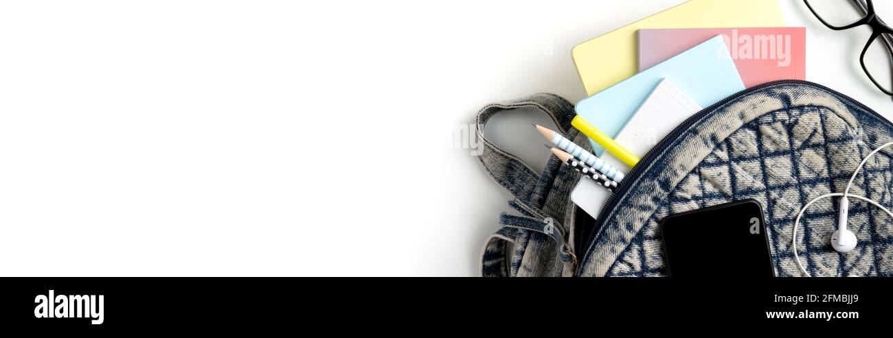 Flat lay top view backpack with different colorful stationery Stock Photo
