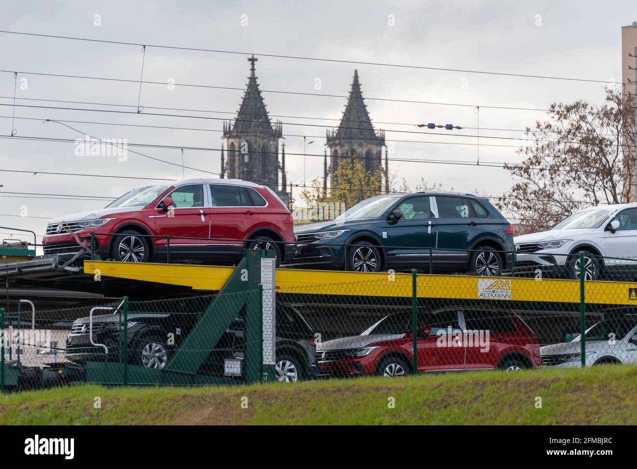 Germany, Saxony-Anhalt, Magdeburg, a freight train with new cars drives into the main station. Stock Photo