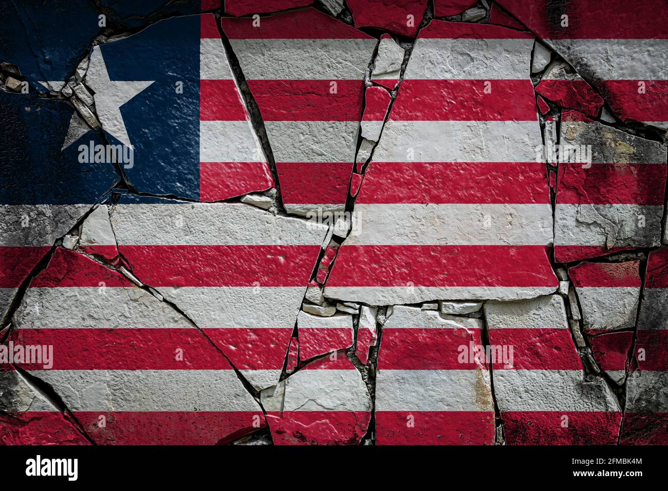 National flag of Liberia depicting in paint colors on an old stone wall ...