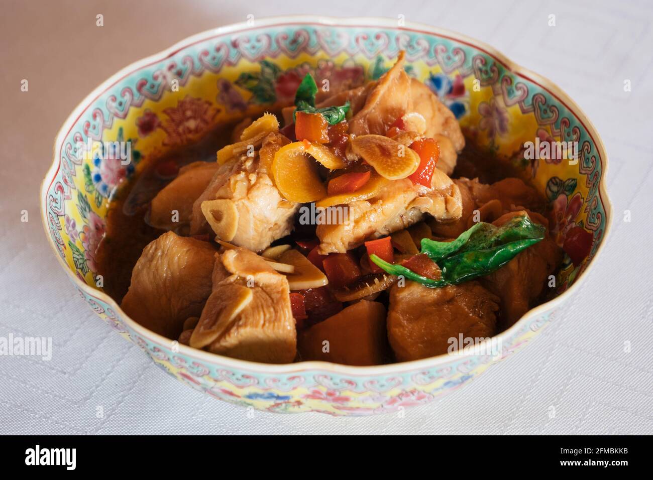 San Bei Ji Three Cup Chicken in a Traditional Chinese Bowl, a Traditional Dish of the Taiwanese Cuisine Stock Photo