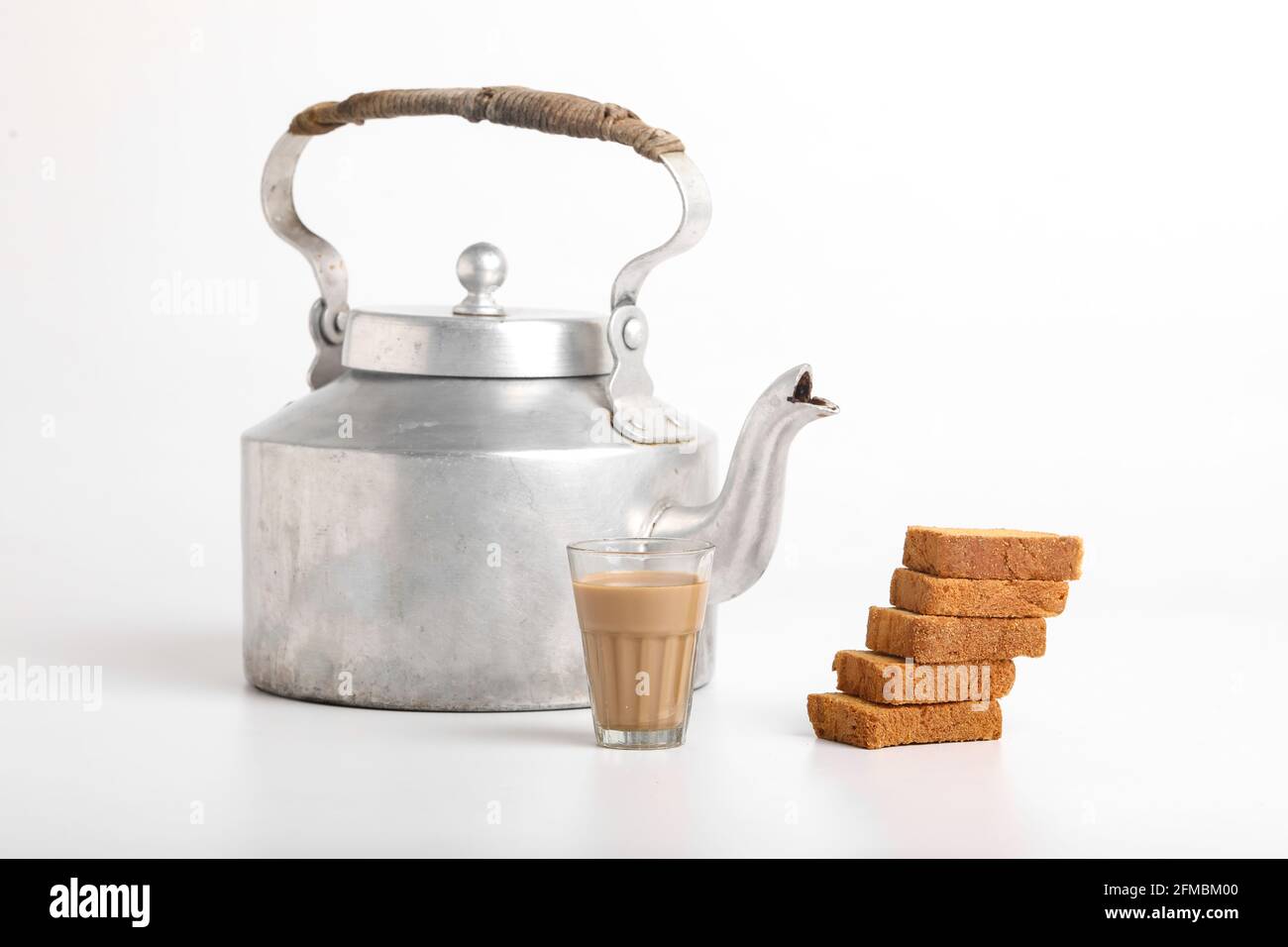 aluminum tea pot or kettle with rusk on white background Stock Photo