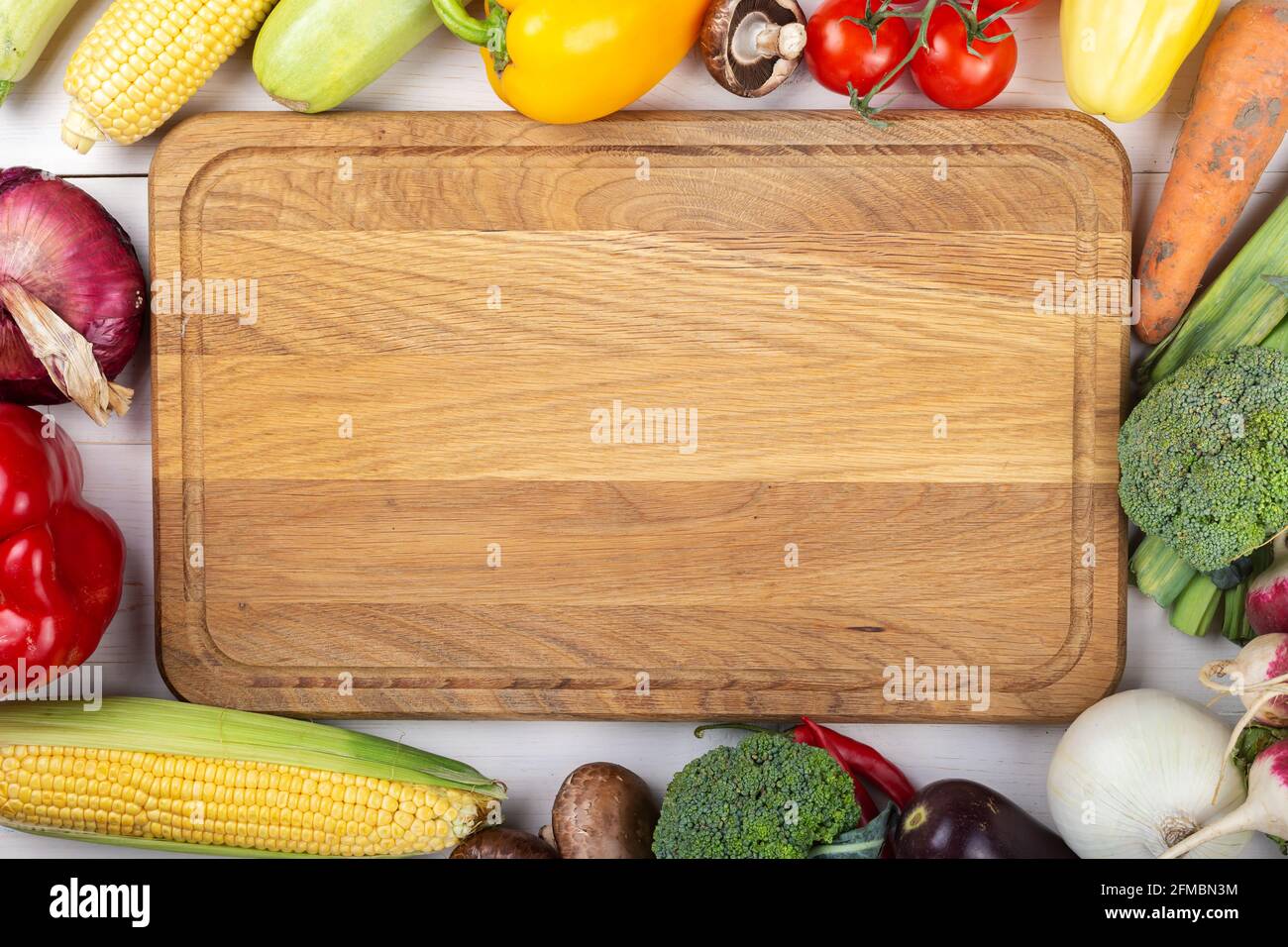 Healthy eating. Vegetables on a white wooden table. Organic food frame ...