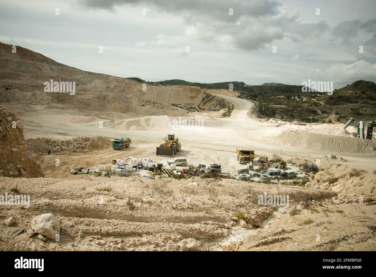 Messy open pit with different rubbish on site Stock Photo