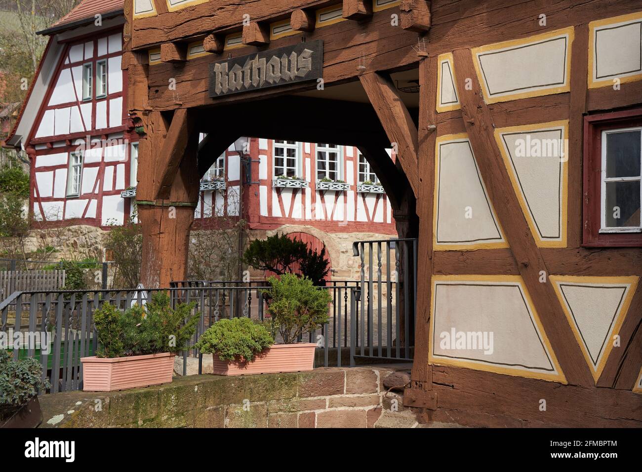 Wooden panel on a half-timbered house saying: Town hall (german: Rathaus). Historical town in Germany. Stock Photo