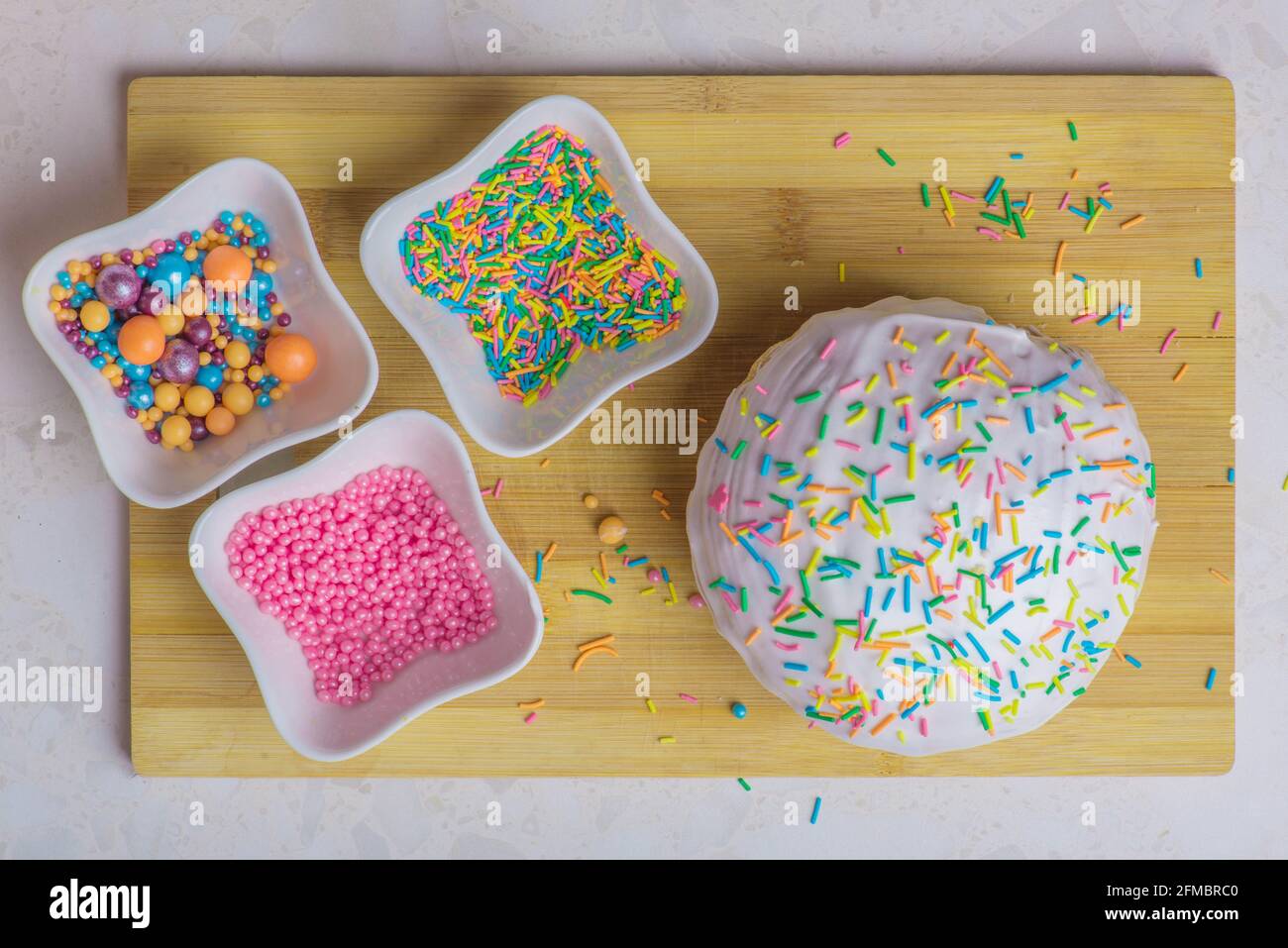 Easter cake and three plates with decorations Stock Photo